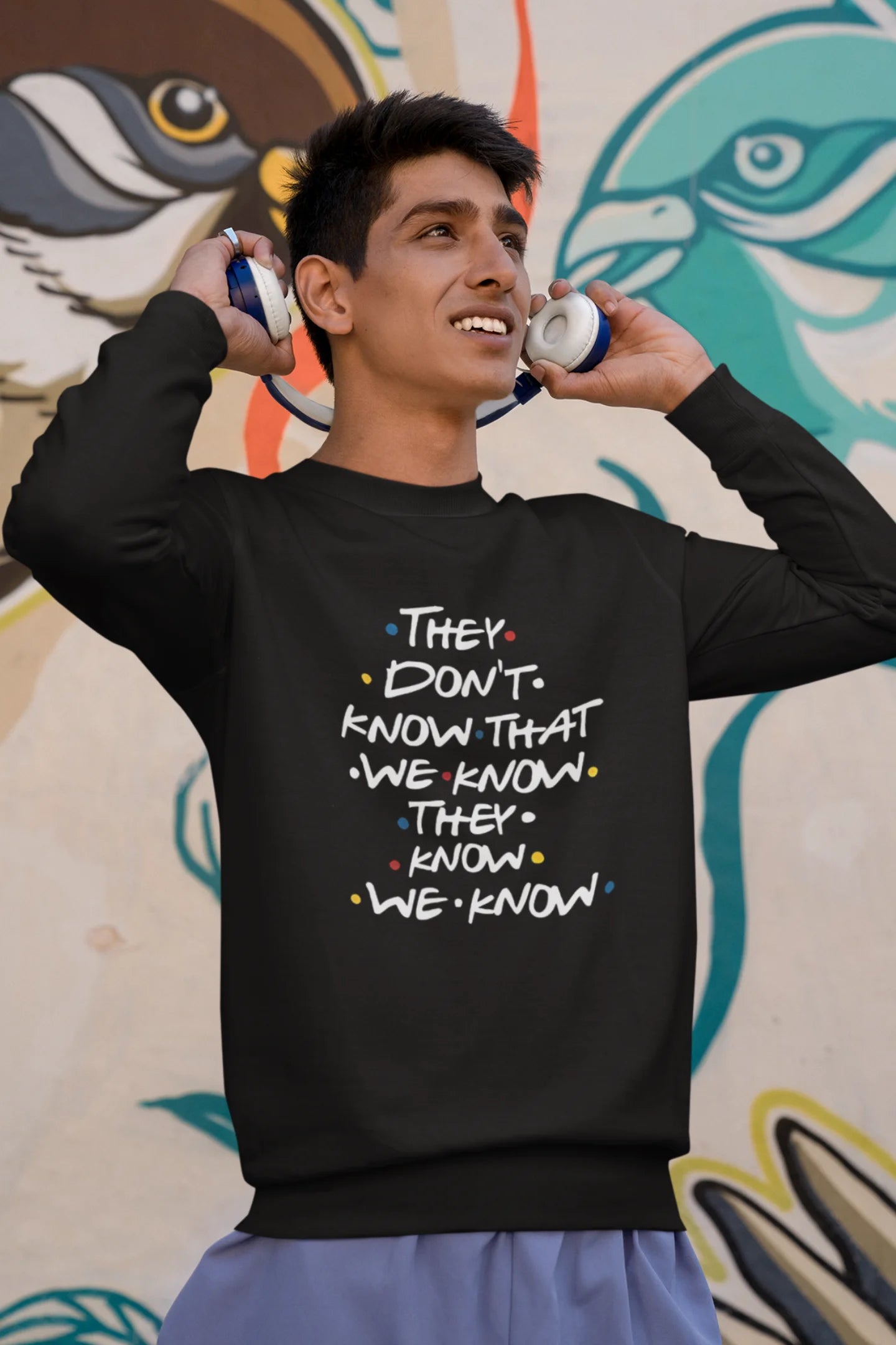 Third image of female model wearing black sweatshirt with F.R.I.E.N.D.S series inspired designs, embodying Phoebe's unique humor with the quote 'They Know We Know'