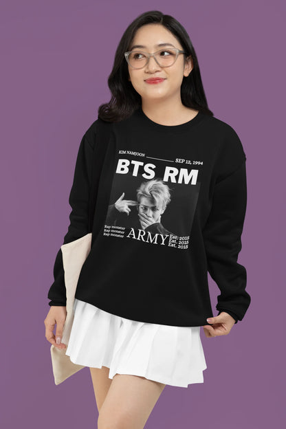 Fourth front view of female model wearing a black sweatshirt featuring a design representing all seven members of BTS. Ideal for BTS fans (ARMY) who want to show their love for the entire group.