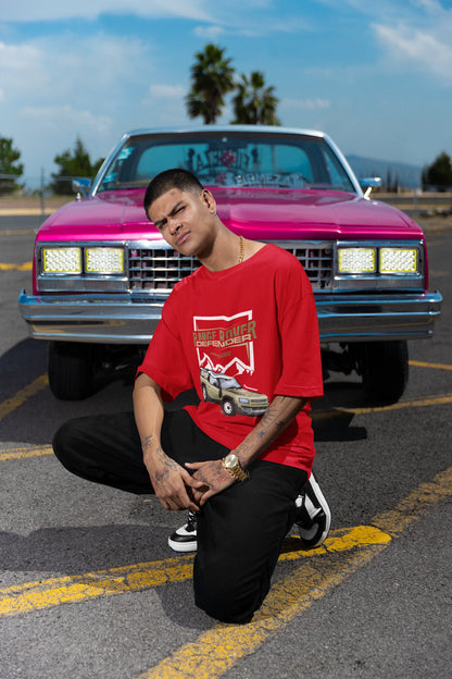 2nd front view of a male model red wearing a oversized t-shirt featuring a design of a Range Rover.