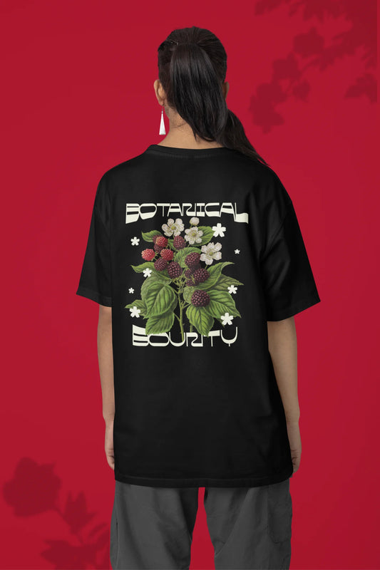 Back of a female model model wearing a black with a design featuring berry bushes overflowing with fruit, symbolizing the abundance and beauty of nature.
