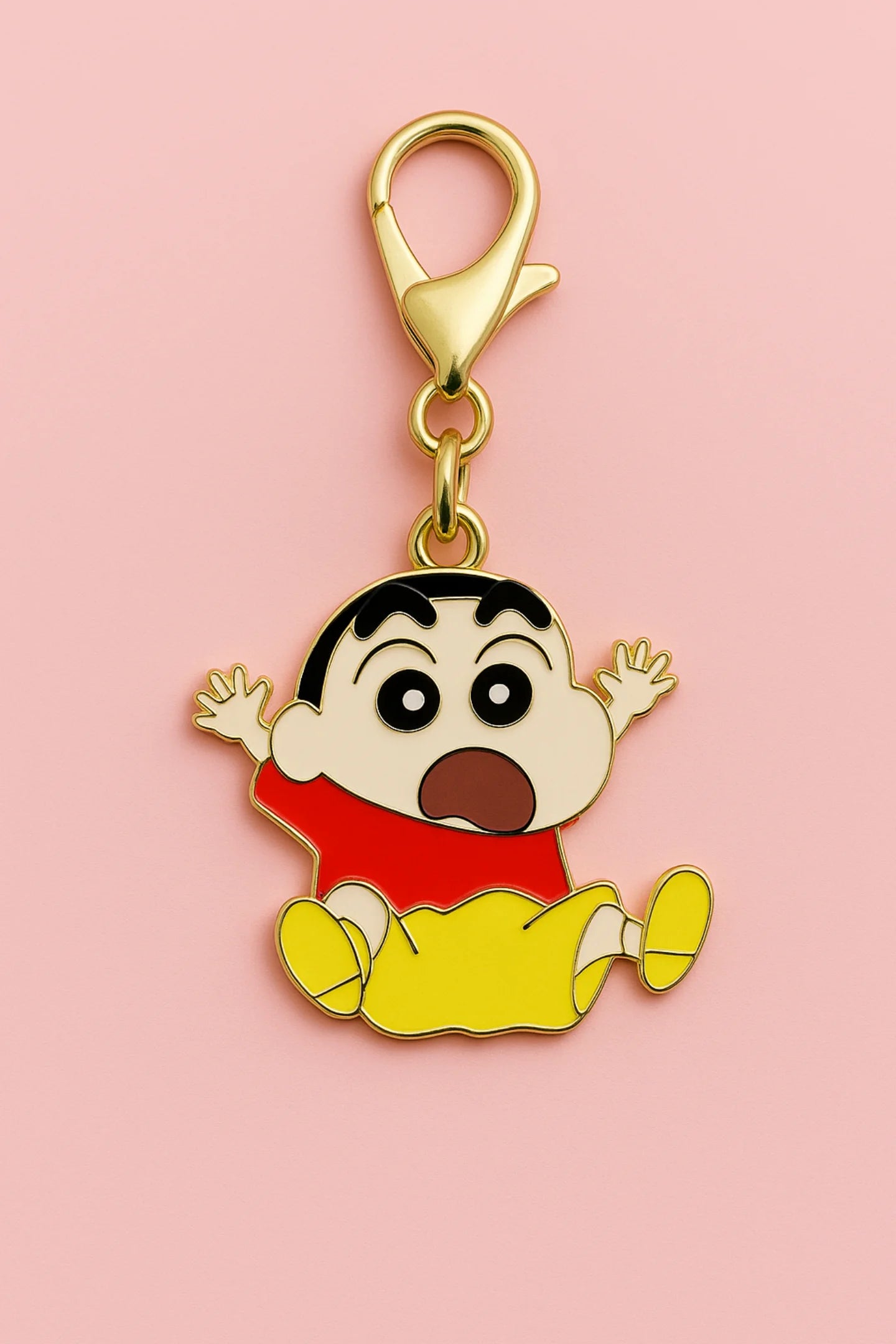 A keychain featuring a charm of Shinchan jumping in the air with the word "Hurray!"