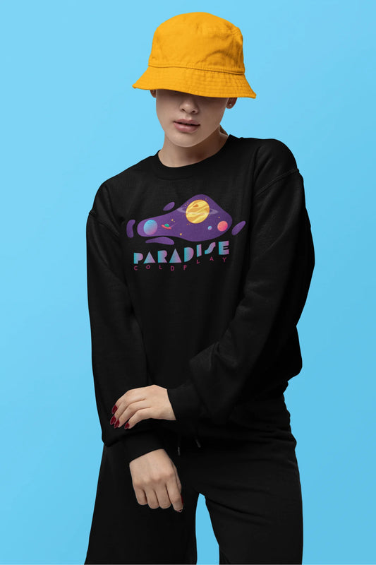 First front view of a female model wearing an black sweatshirt with the "Paradise" album artwork by Coldplay.