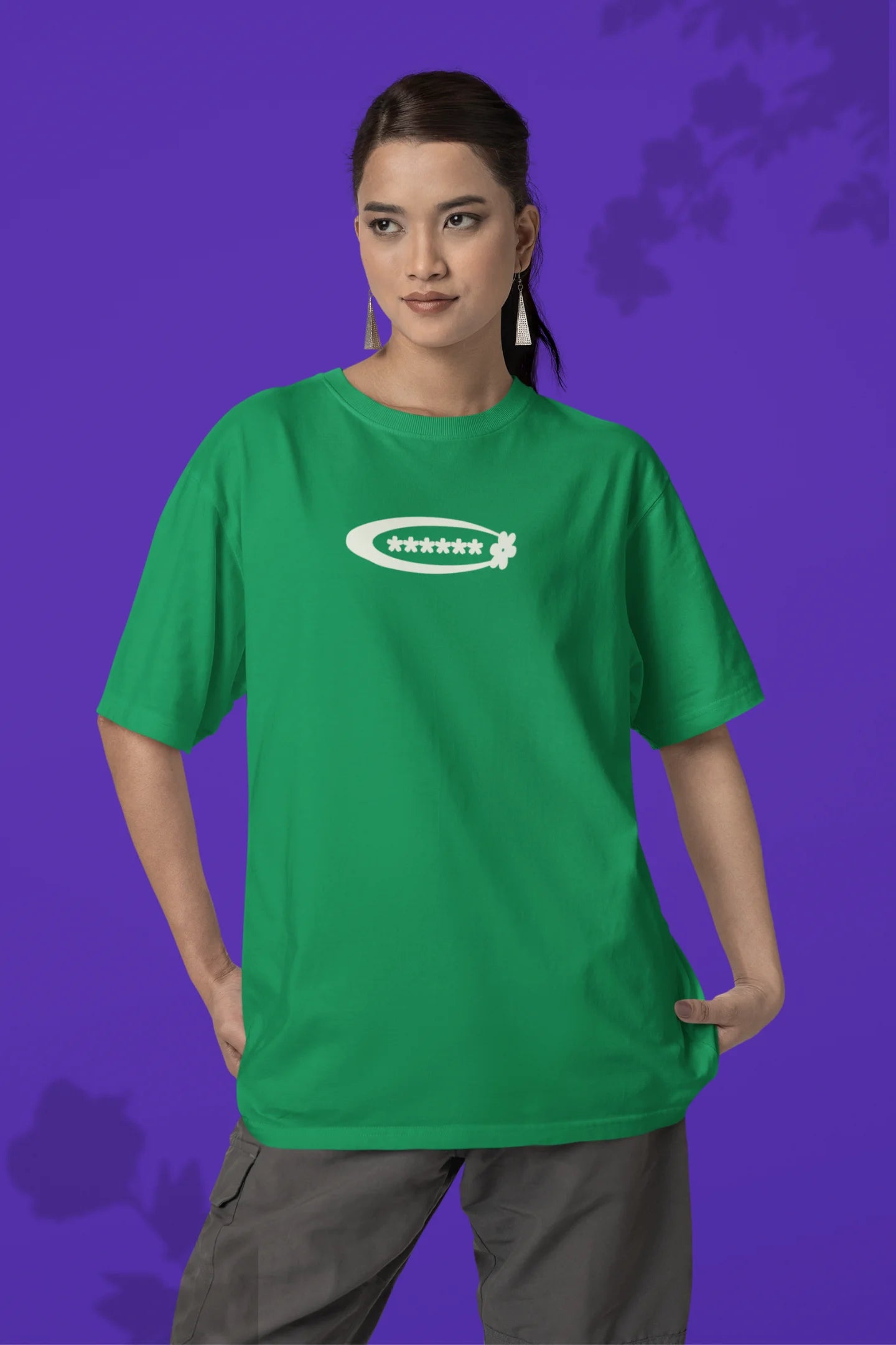 First front of a female model model wearing a forest green with a design featuring berry bushes overflowing with fruit, symbolizing the abundance and beauty of nature.