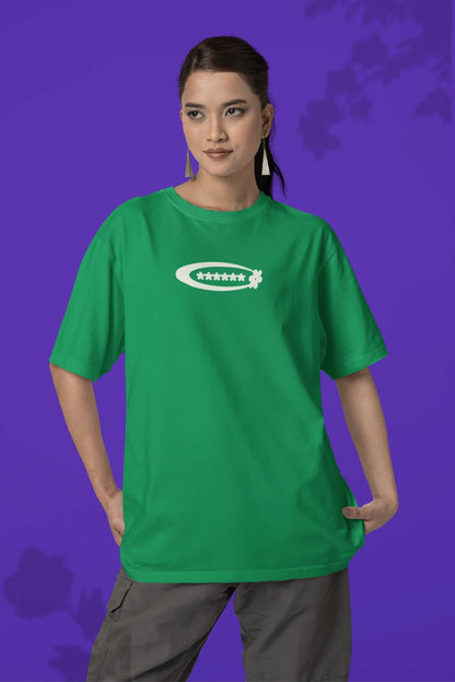First front of a female model model wearing a forest green with a design featuring berry bushes overflowing with fruit, symbolizing the abundance and beauty of nature.