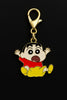 Another view of a keychain featuring a charm of Shinchan jumping in the air with the word 