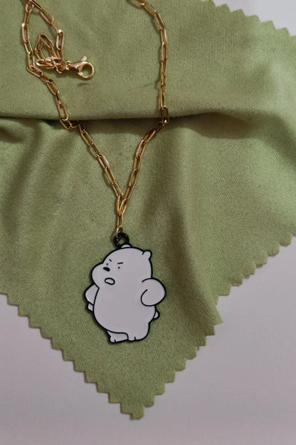 First view of a gold chain necklace with a small pendant shaped like Ice Bear.