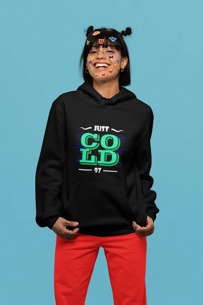 2nd front view of a female model wearing an black sweatshirt with the text "Just Cold" printed on it.
