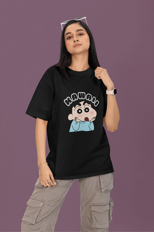 2nd front view of a female model wearin a black oversized t-shirt featuring Shinchan looking amazed and saying "Kawaii."