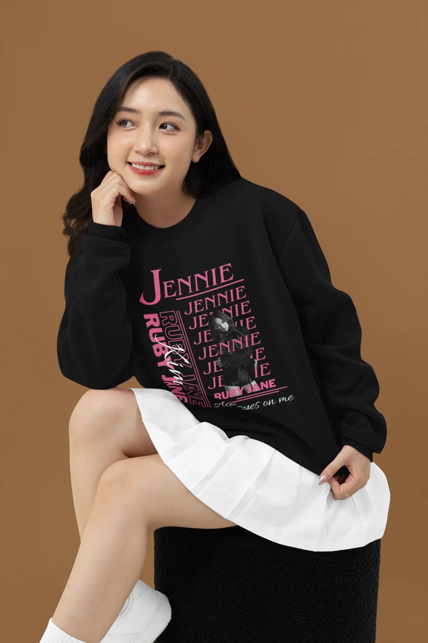 Third front view of female model wearing a black sweatshirt featuring a stylish design inspired by Blackpink member Jennie. Ideal for fans of Jennie, Blackpink, and K-Pop music enthusiasts interested in idol fashion.