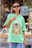 Second image of woman wearing mint green oversized t-shirt featuring 'Adore You' inspired design - ideal for fans of Harry Styles and One Direction