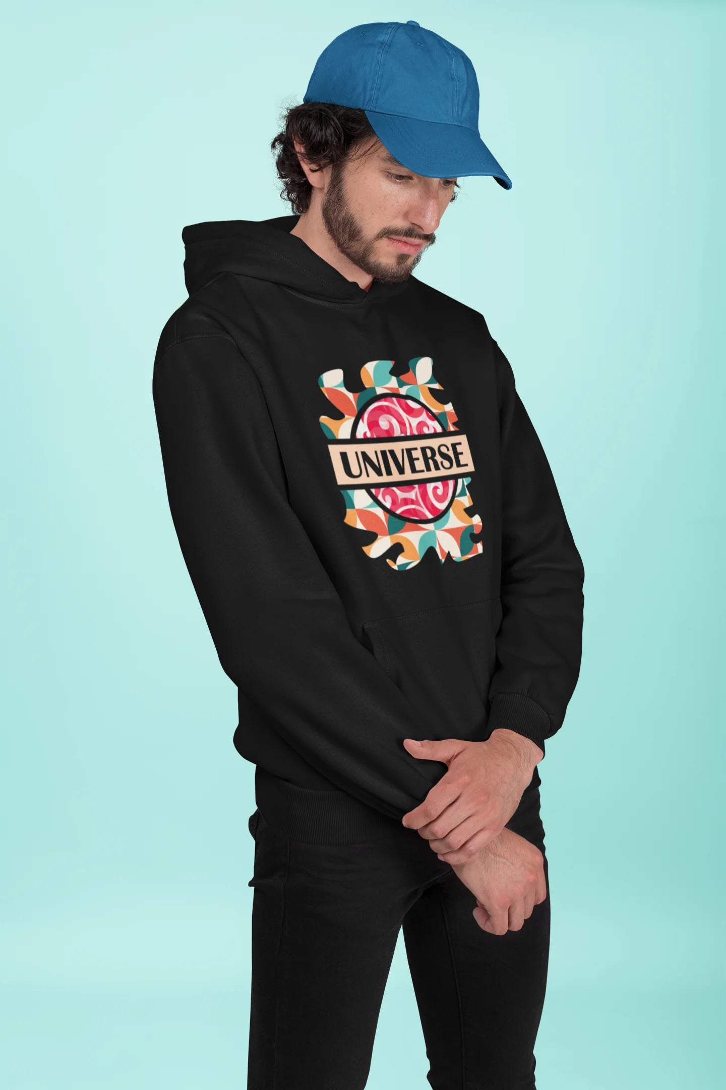 2nd front view of a male model wearing an black hoodie with a cosmic Universe design inspired by Coldplay.