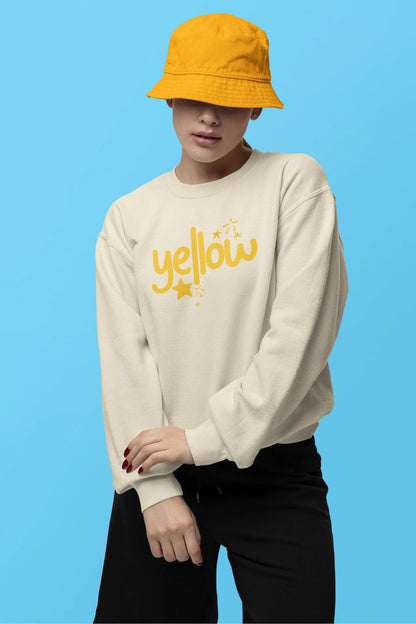First front view of a female model wearing a cream sweatshirt with the "Yellow" album artwork by Coldplay.