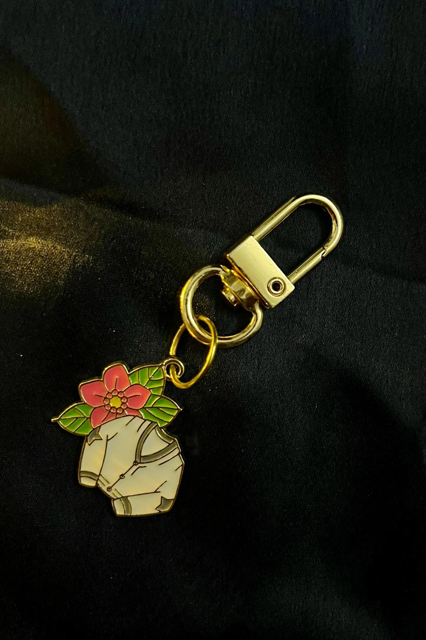 Fifth view of a cute swiftie keychain featuring a Cardigan design inspired by Taylor Swift's "Folklore" album.