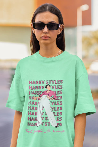 First image of female model wearing mint green oversized t-shirt inspired by Harry Styles, featuring the 'Treat People with Kindness' mantra from the Fine Line collection.
