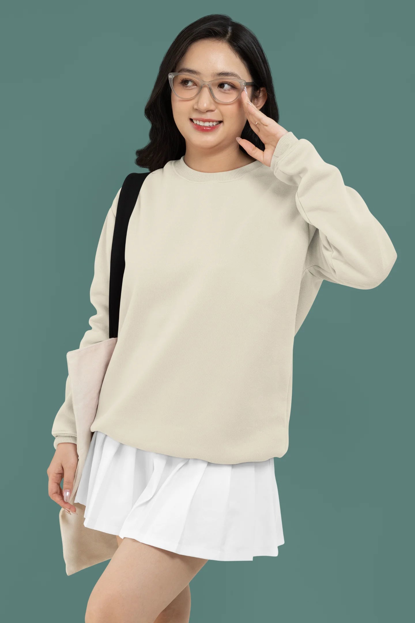 First front view of a female model wearing a off-cream F.R.I.E.N.D.S. sweatshirt featuring a fun design inspired by Phoebe Buffay and her iconic quotes.