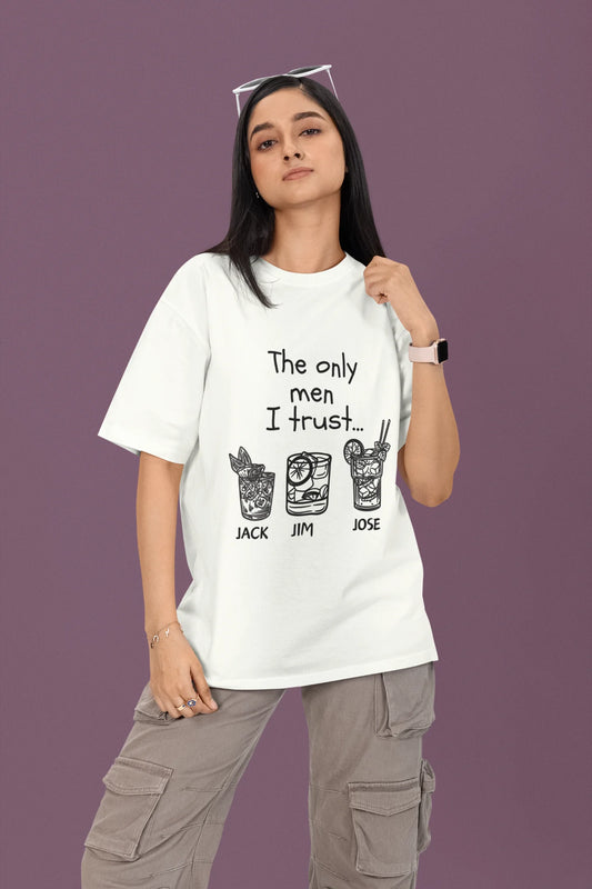 First front view of a female model wearing a off-white oversized t-shirt with the text "Only Men I Trust: Jack, Jim, and Jose" and three drink designs underneath.