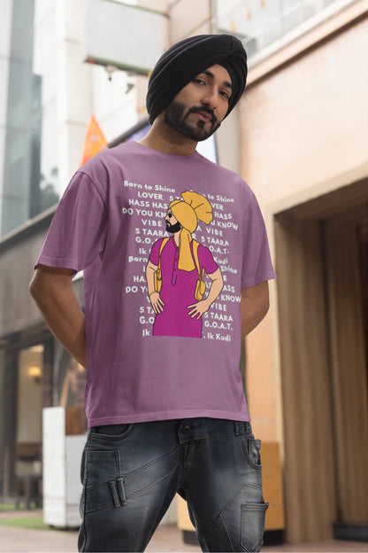 Fourth image of a male model wearing a dirty purple oversized t-shirt with a Diljit Dosanjh portrait on a t-shirt with his album titles written in the background.