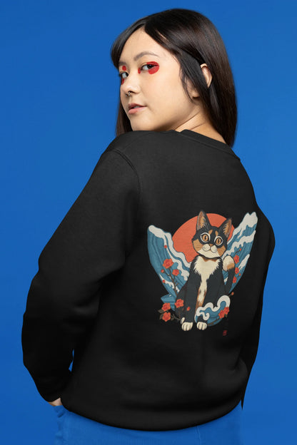 Back view of female model wearing a black sweatshirt with a design of a cat dressed as a samurai, standing against a backdrop of waves and a rising sun.