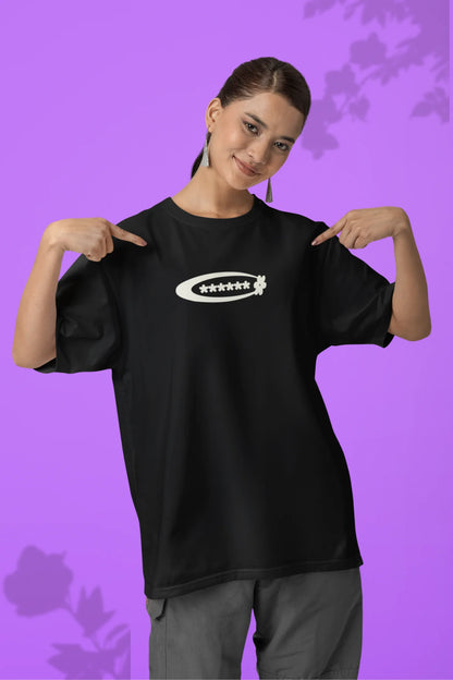 2nd front of a female model model wearing a black with a design featuring berry bushes overflowing with fruit, symbolizing the abundance and beauty of nature.