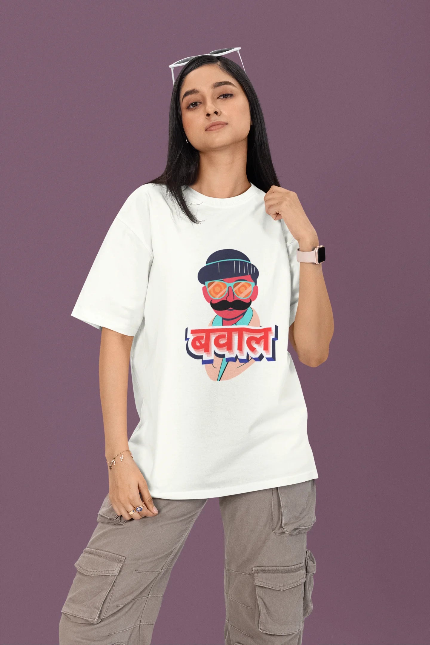 3rd front view of a female model wearing a off-white oversized t-shirt with "Bawaal" in a stylish Hindi.
