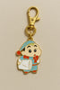 A keychain featuring a charm of Shinchan in pajamas, yawning.