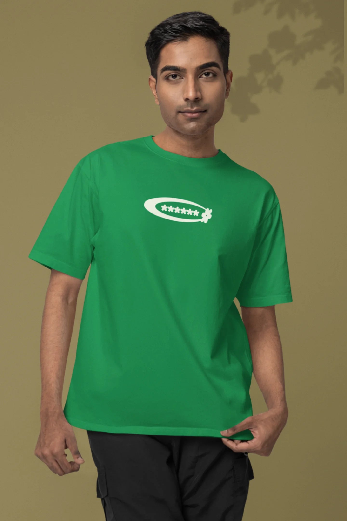 First front of a male model model wearing a forest green with a design featuring berry bushes overflowing with fruit, symbolizing the abundance and beauty of nature.
