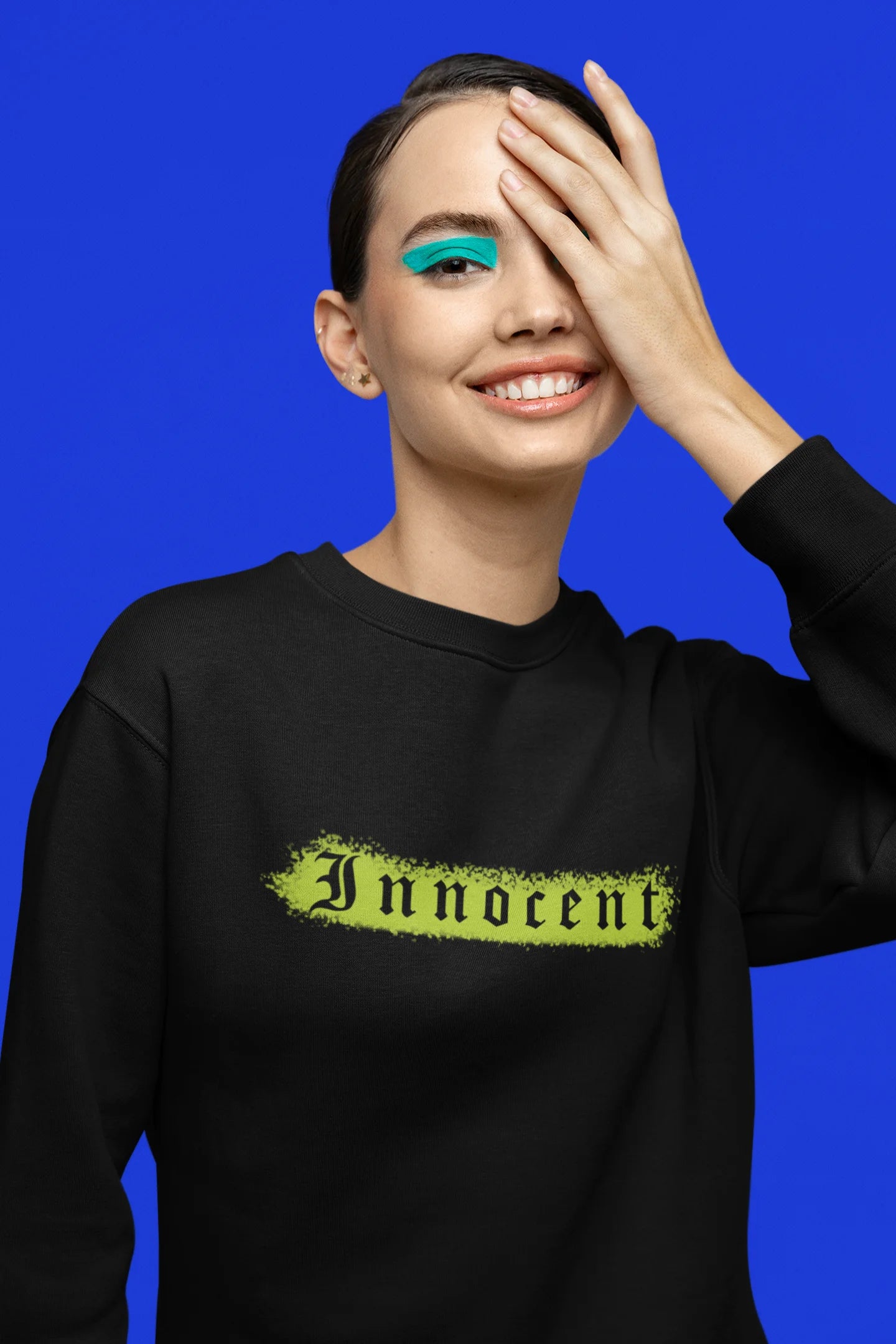 Fifth front view of a female model wearing a black sweatshirt with a contrasting design of a cupid statue and brutalist elements.