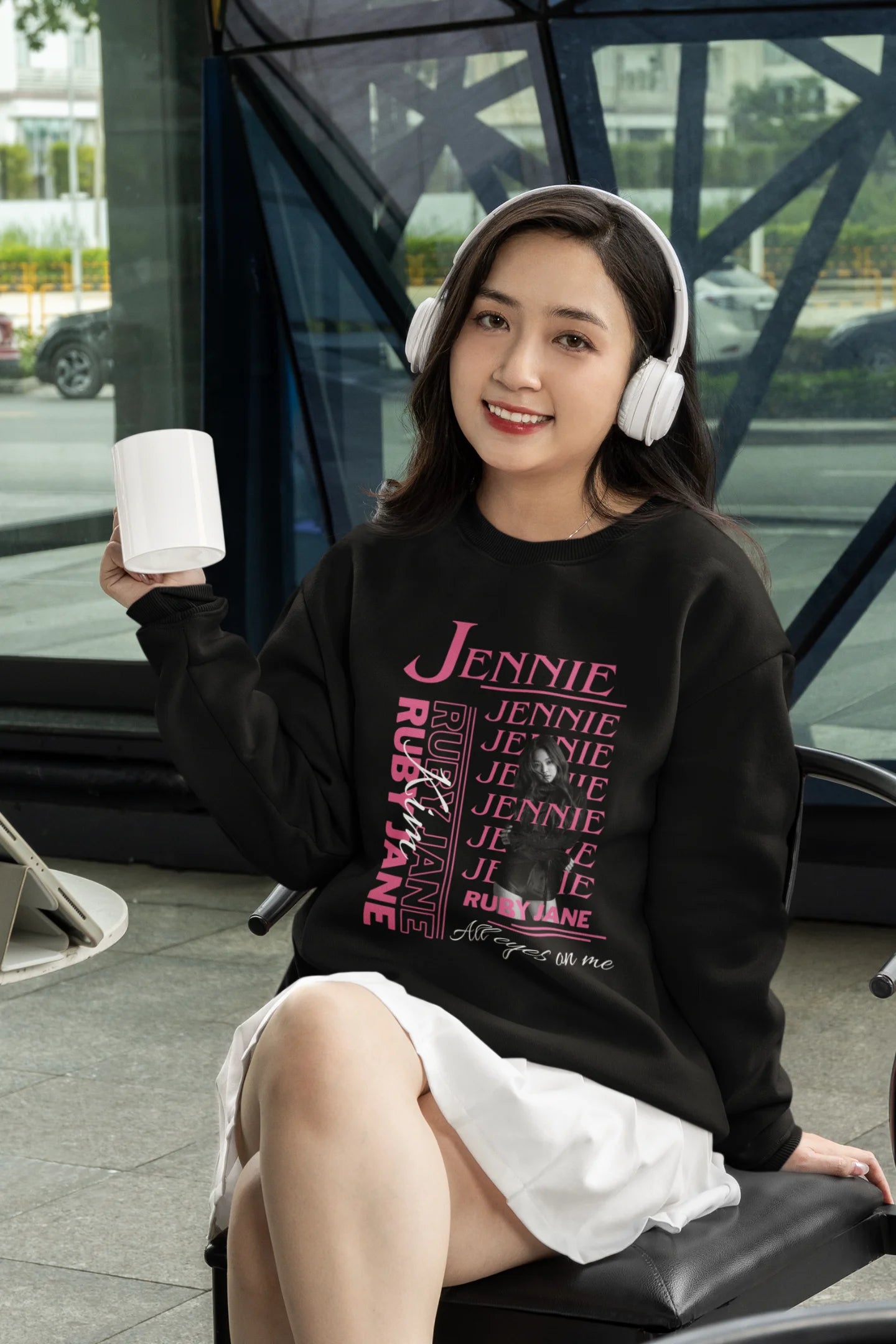 First front view of female model wearing a black sweatshirt featuring a stylish design inspired by Blackpink member Jennie. Ideal for fans of Jennie, Blackpink, and K-Pop music enthusiasts interested in idol fashion.