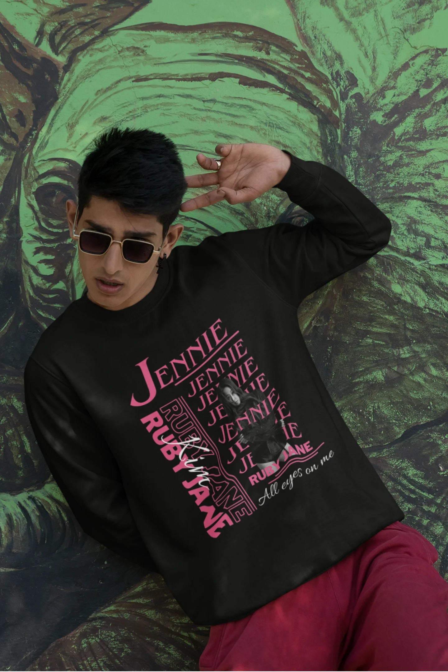 Third front view of male model wearing a black sweatshirt featuring a stylish design inspired by Blackpink member Jennie. Ideal for fans of Jennie, Blackpink, and K-Pop music enthusiasts interested in idol fashion.