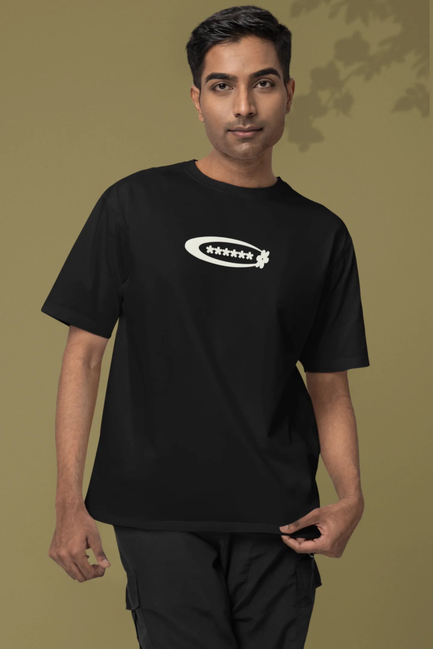 2nd front of a male model model wearing a black with a design featuring berry bushes overflowing with fruit, symbolizing the abundance and beauty of nature.