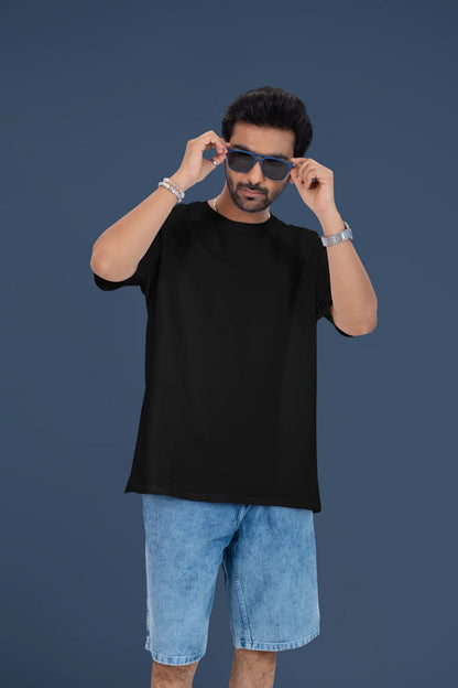 4th front view of a male model wearing a black oversized t-shirt featuring lyrics from Ed Sheeran's song "Perfect" against a night sky design.