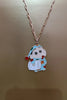 First view of a gold chain necklace with a small pendant depicting Shin Chan sleeping.