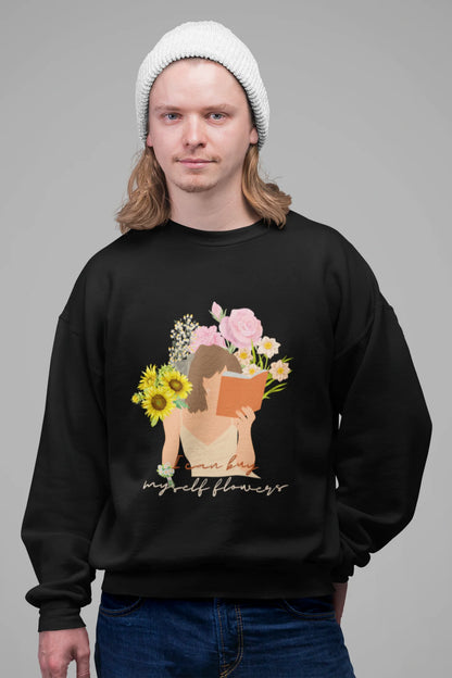 2nd front view of male model wearing a black sweatshirt with a positive message "Buy Myself Flowers" and a graphic of a smiling woman surrounded by tulips and sunflowers. Ideal for those who love inspirational clothing and floral designs.