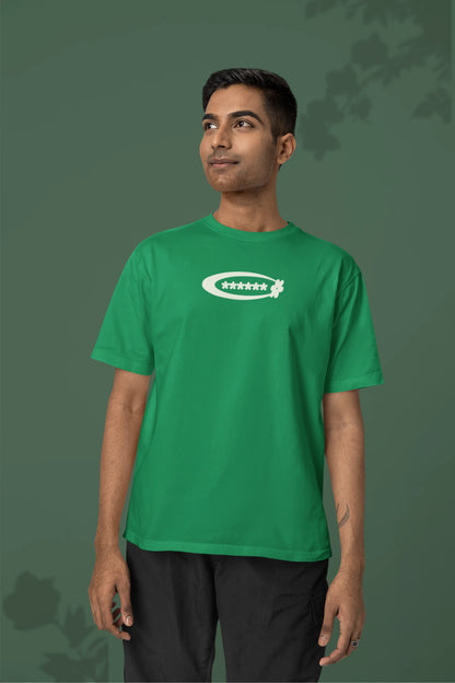 2nd front of a male model model wearing a forest green with a design featuring berry bushes overflowing with fruit, symbolizing the abundance and beauty of nature.