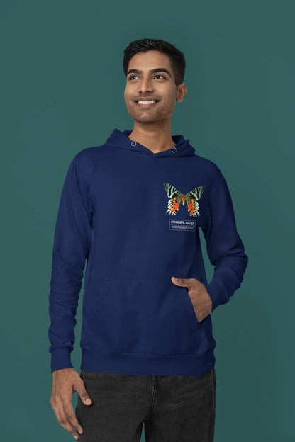 First front view of a male model wearing a navy blue hoodie with a glowing butterfly design, symbolizing the ethereal beauty of nature.