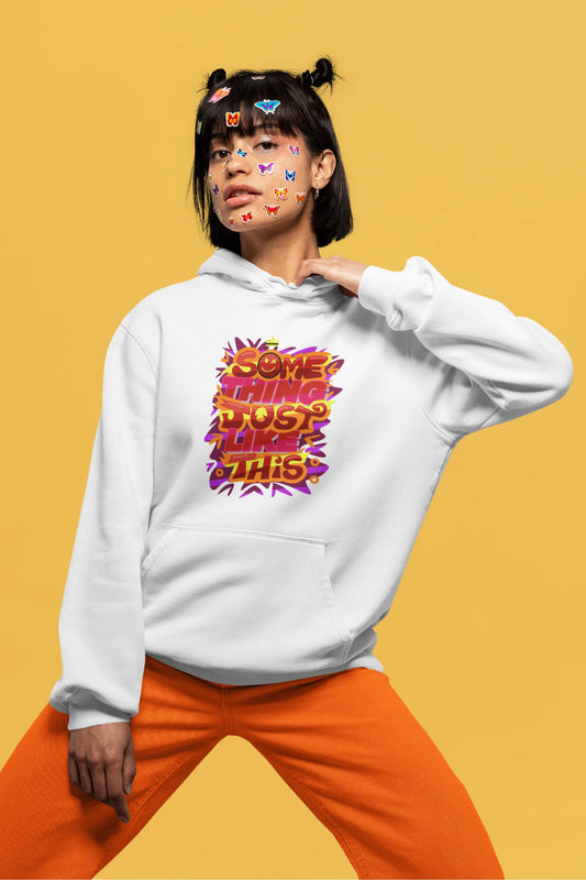 Second front view of a female model wearing an off-white hoodie featuring the designs inspired from Coldplay's "Something Just Like This" music video.