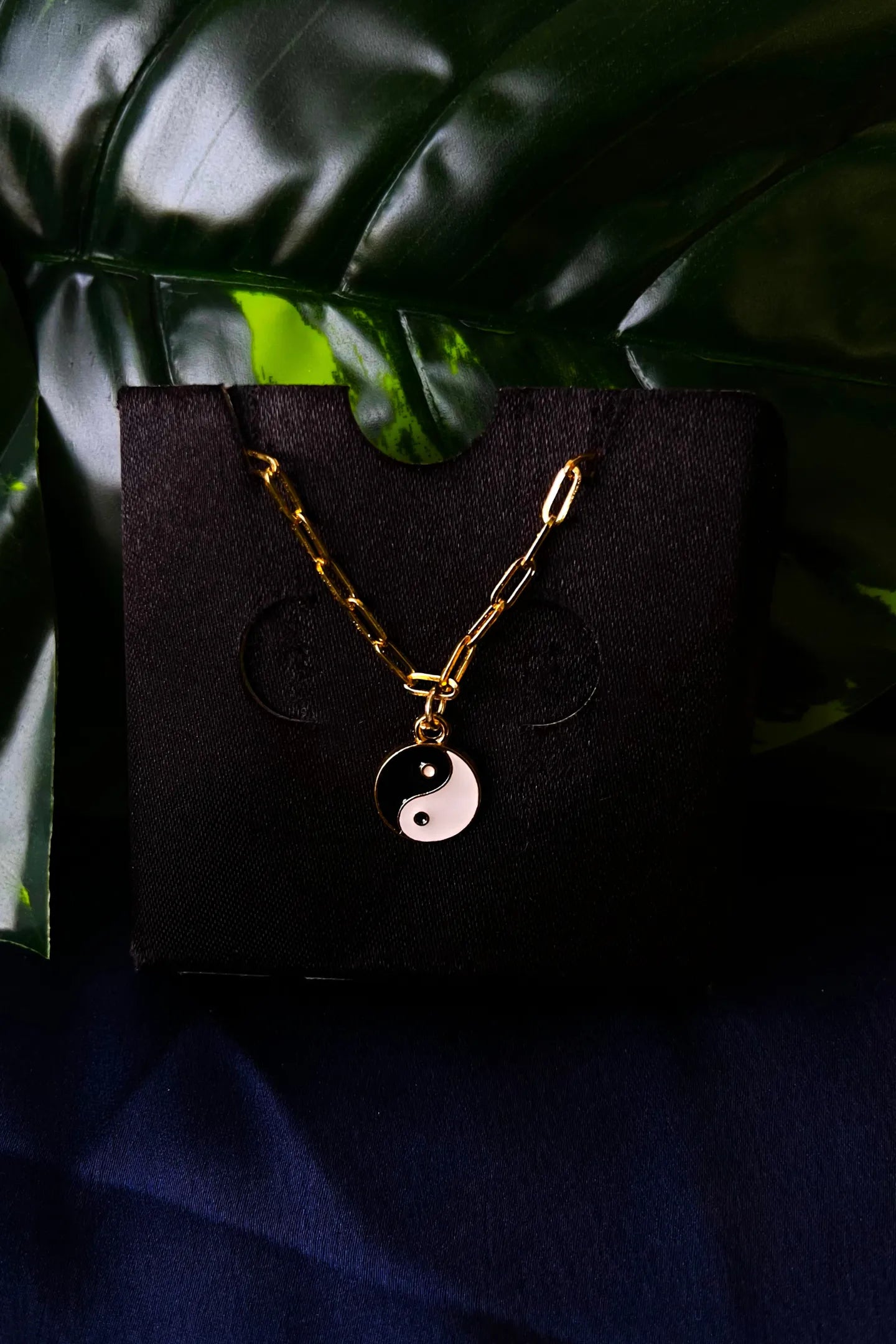 First image of a yin and yang gold chain.