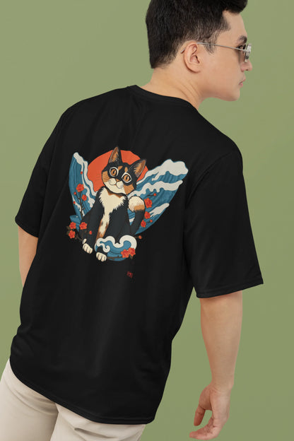 2nd back view of a male model wearing a black oversized tee with a design of a cat dressed as a samurai, standing against a backdrop of waves and a rising sun.