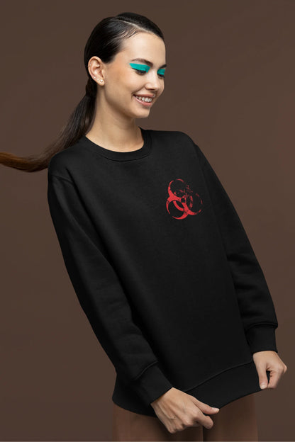 Second front view of a female model wearing a black brutalist sweatshirt with a stylized, concrete-like image of an abstract statue and the word "Experiment" prominently displayed.