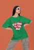 2nd front view of a female model wearing a forest green oversized t-shirt with the text 