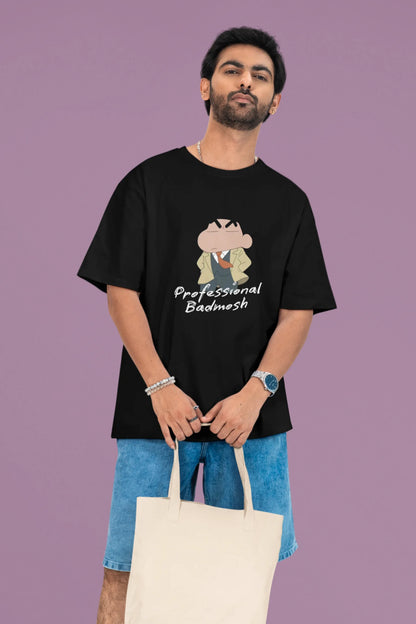 2nd front view of a male model wearing a black oversized t-shirt featuring Shinchan wearing a suit and trench coat with text saying "Professional Badmosh".