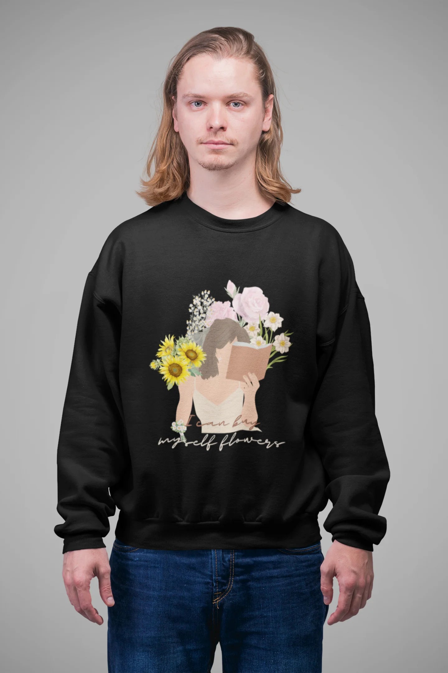 4th front view of male model wearing a black sweatshirt with a positive message "Buy Myself Flowers" and a graphic of a smiling woman surrounded by tulips and sunflowers. Ideal for those who love inspirational clothing and floral designs.
