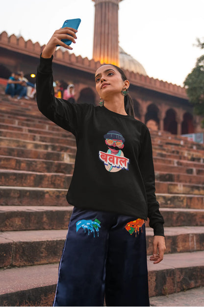 6th front view of a female model wearing a black oversized t-shirt with "Bawaal" in a stylish Hindi.