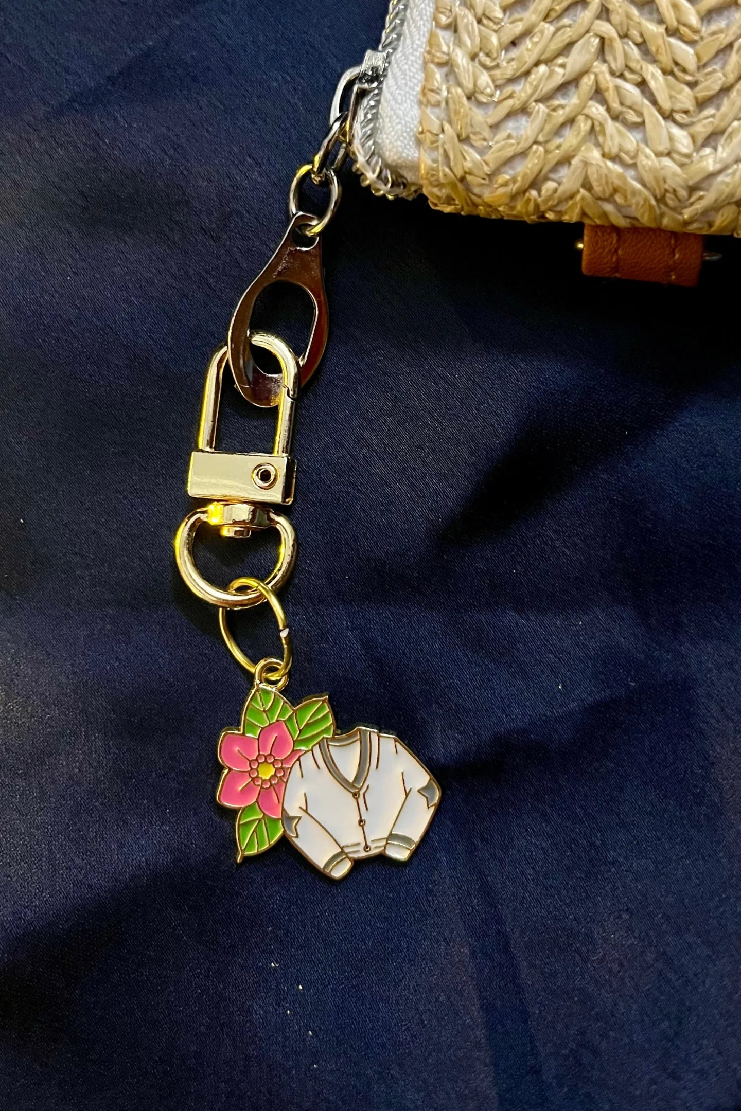 Fourth view of a cute swiftie keychain featuring a Cardigan design inspired by Taylor Swift's "Folklore" album.