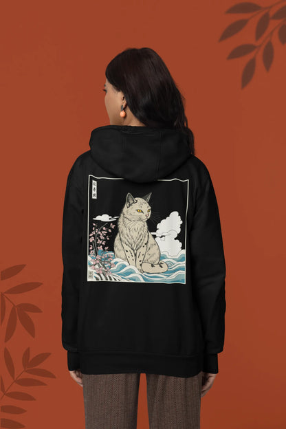 Back view of a female model wearing a black hoodie with a design of a wildcat sitting on ocean waves.