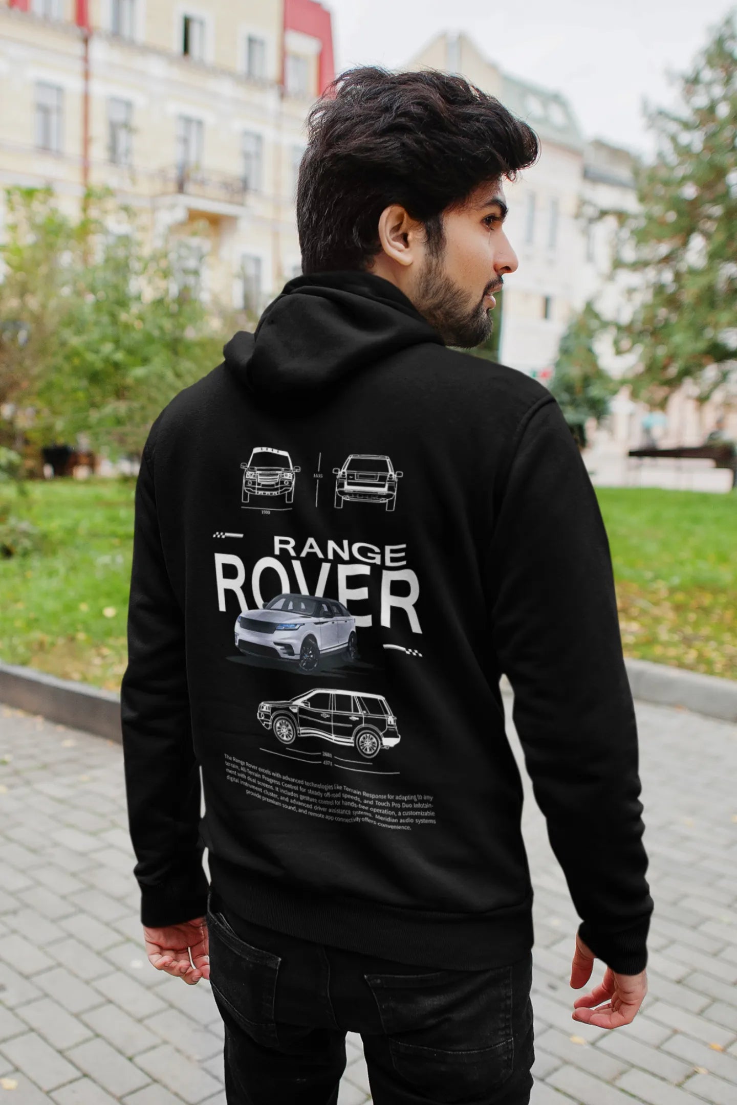 Back view of a male model wearing a black hoodie featuring a Range Rover design, exuding power and ruggedness.