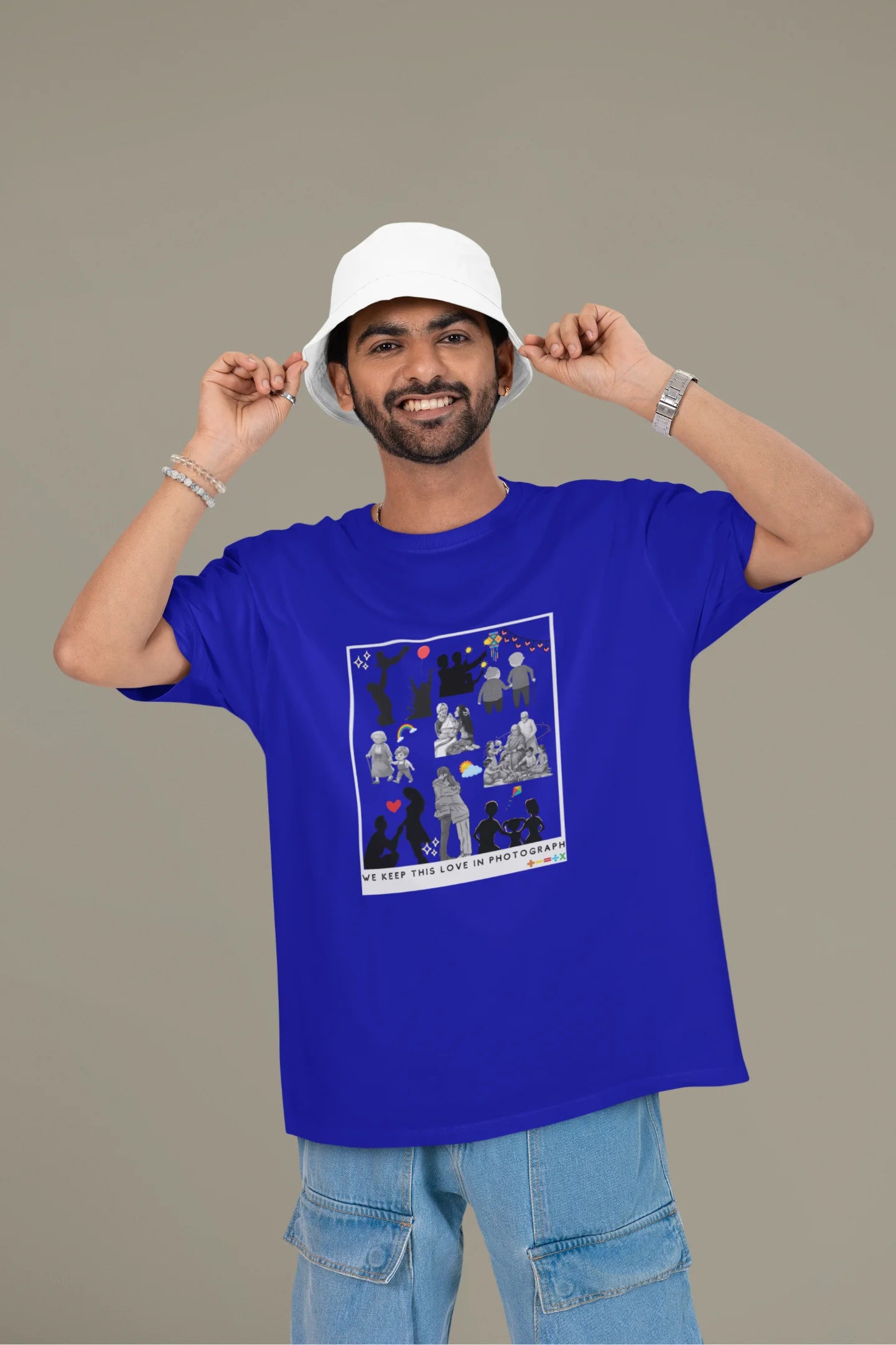 First front view of a male model wearing a royal blue oversized t-shirt featuring a design that represents cherished memories, inspired by Ed Sheeran's "Photograph."