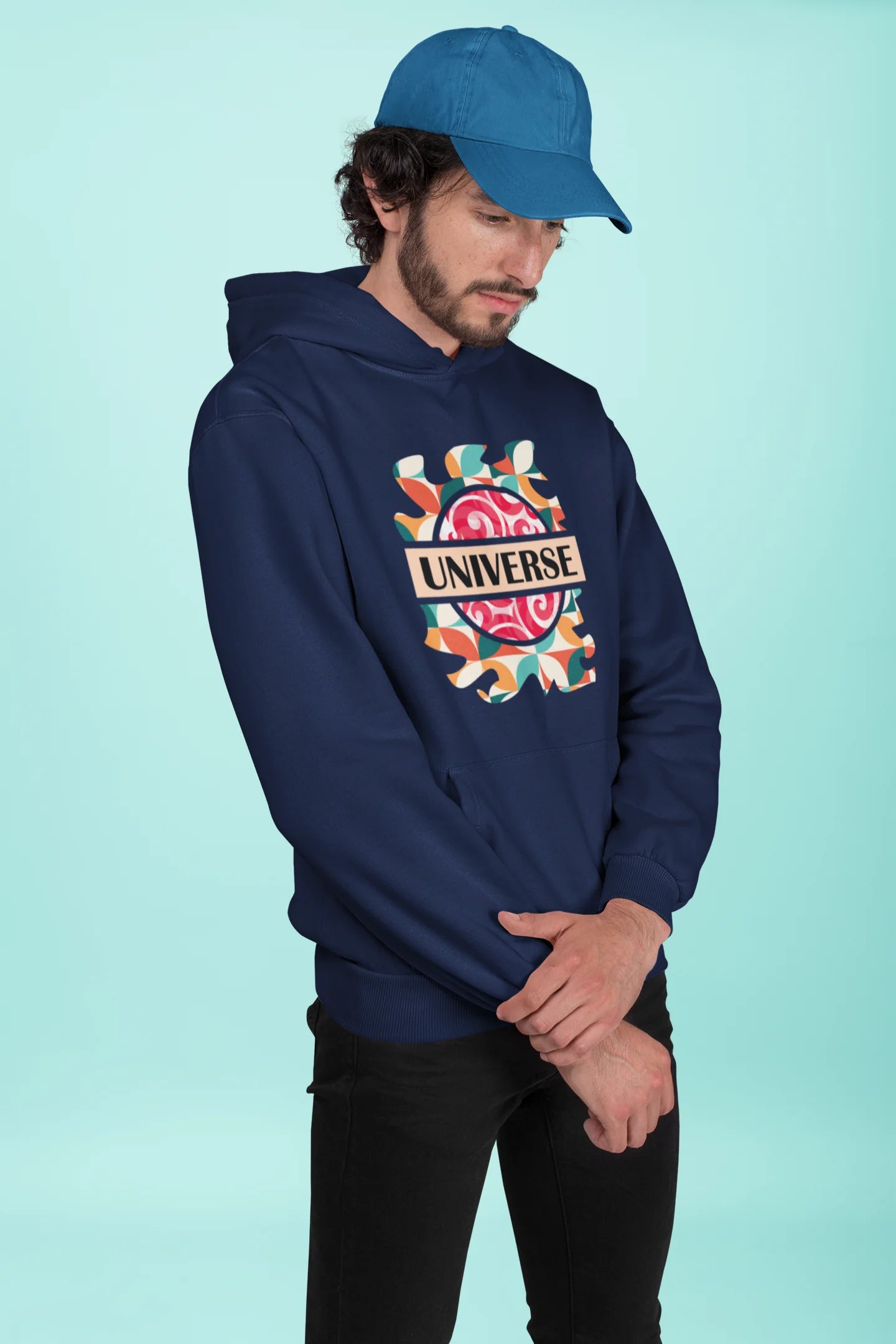 3rd front view of a male model wearing an royal blue hoodie with a cosmic Universe design inspired by Coldplay.