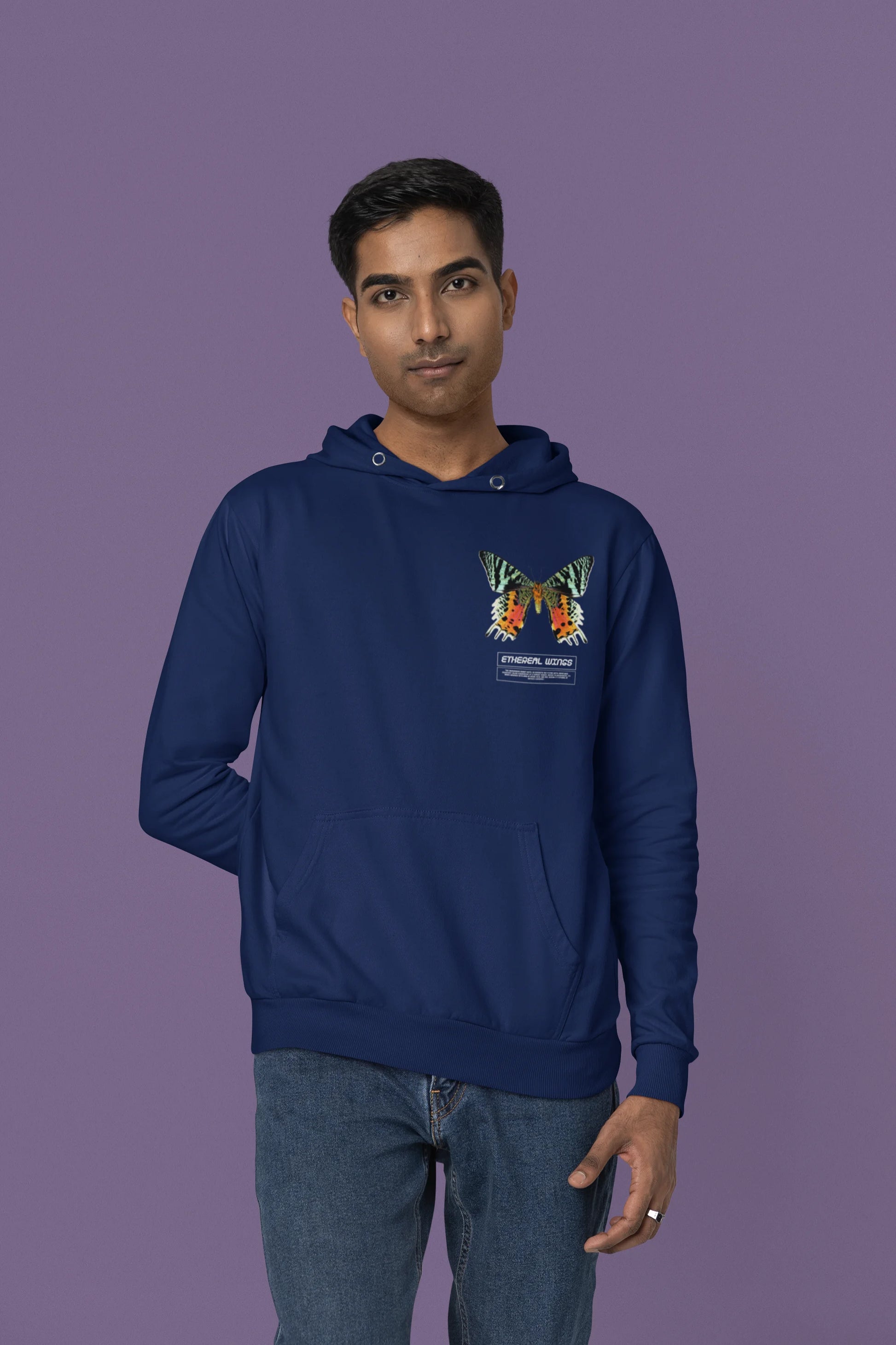 Fourth front view of a male model wearing a navy blue hoodie with a glowing butterfly design, symbolizing the ethereal beauty of nature.