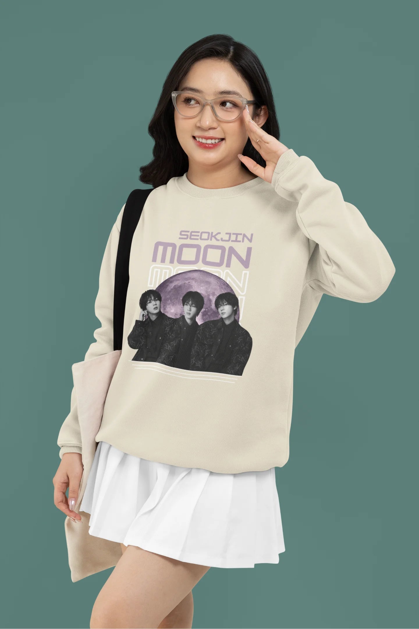 First front view of female model wearing an cream sweatshirt featuring a unique design inspired by BTS member Jin, also known as "Worldwide Handsome." Ideal for fans of BTS and K-Pop music enthusiasts in general. 